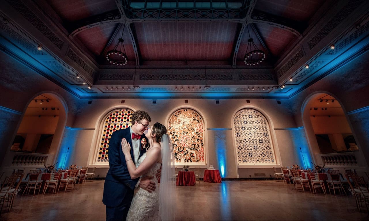 Wedding couple dancing in the court of the Newark Museum of Art