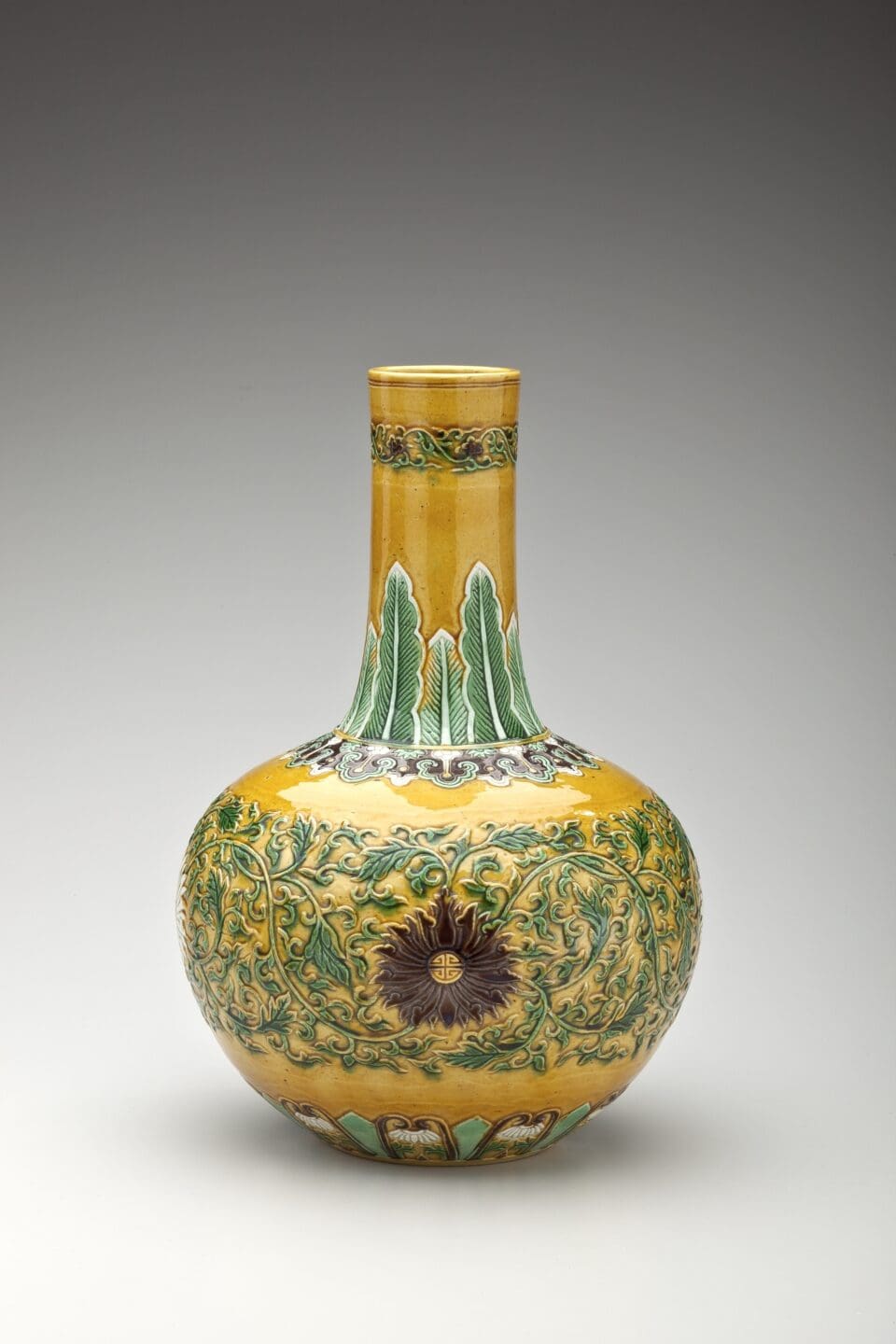 Unrecorded artist, Bottle Vase with Raised Lotus and Banana Leaf Motifs, Qianlong Mark and Period (1736-95), Qing Dynasty (1644-1911) Porcelain with copper-red glaze, 6 1/4 x 11 3/4 in. (15.9 x 29.8 cm) Gift of Herman A. E. Jaehne and Paul C. Jaehne, 1941 | 41.2014